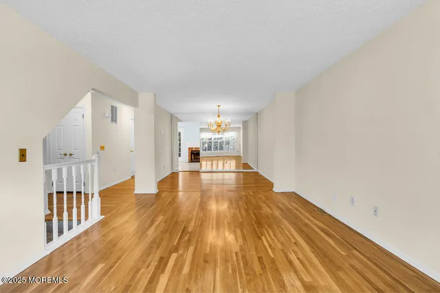 a view of a living room with wooden floor