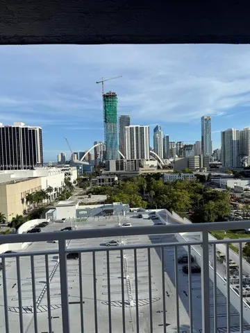 a front view of a building with outdoor seating