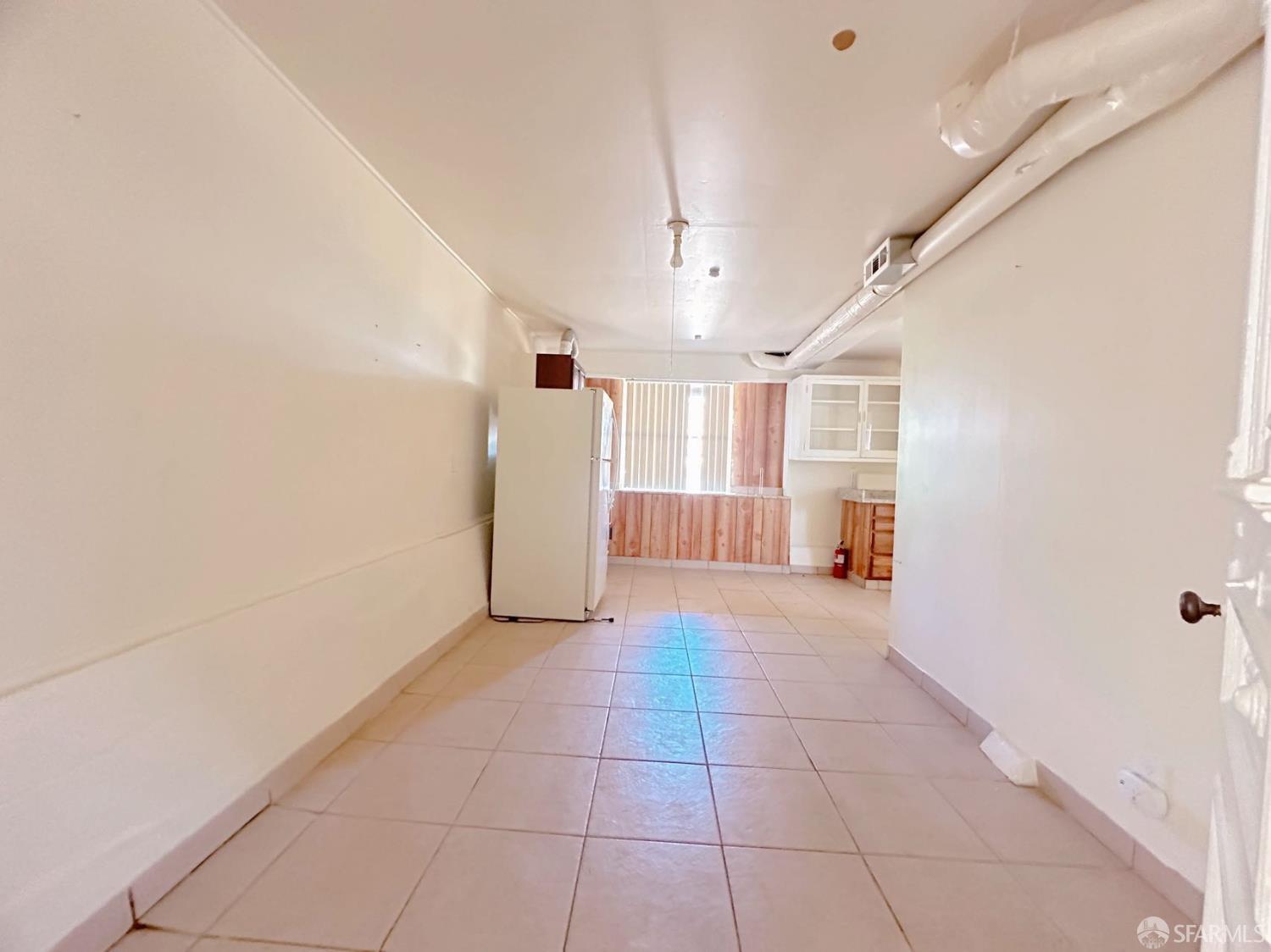 322 Commercial Avenue South San Francisco, CA 94080 - Photo 11 of 32 a view of hallway with a window and a kitchen