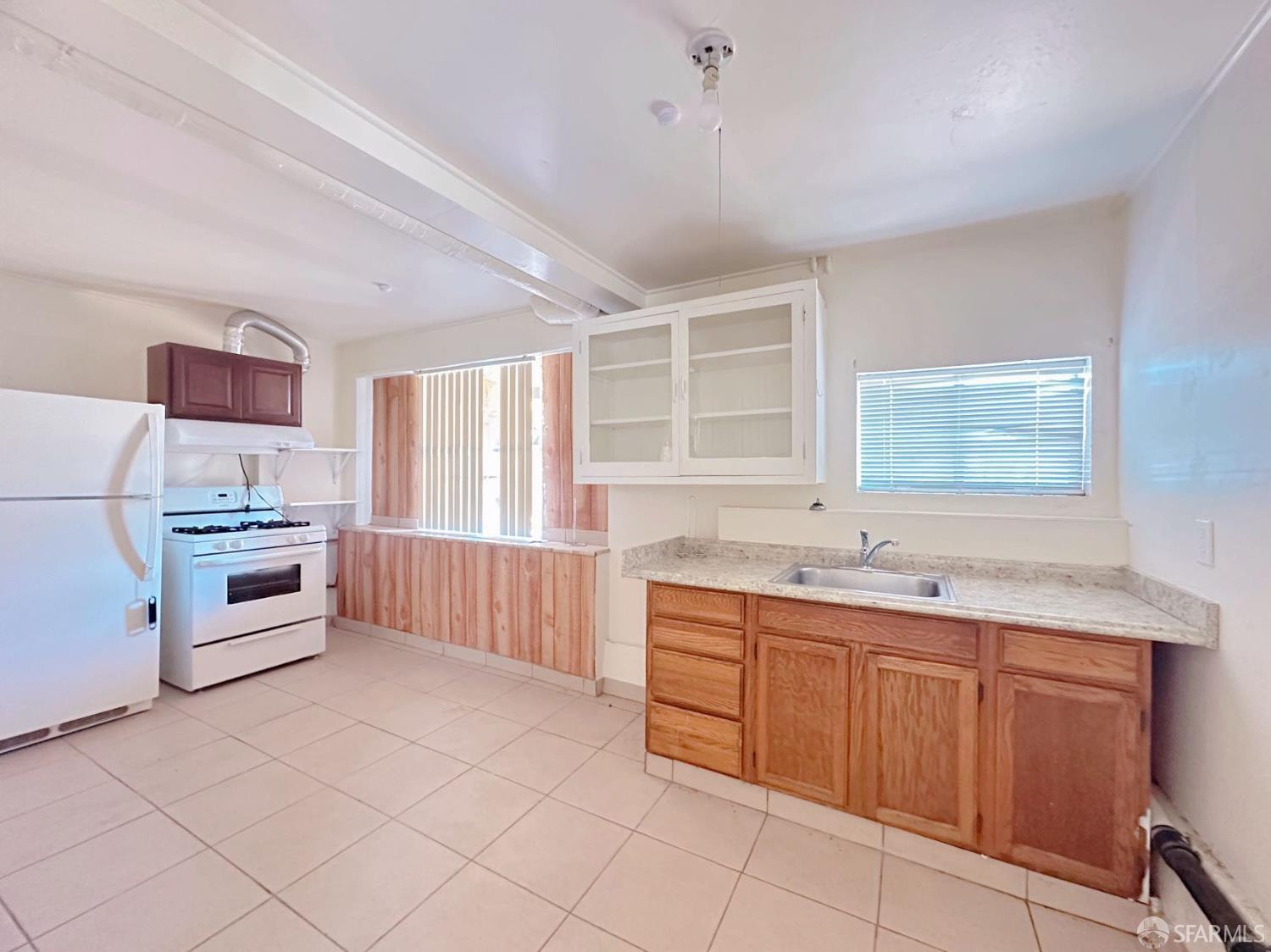 322 Commercial Avenue South San Francisco, CA 94080 - Photo 13 of 32 a kitchen with stainless steel appliances a sink stove and cabinets