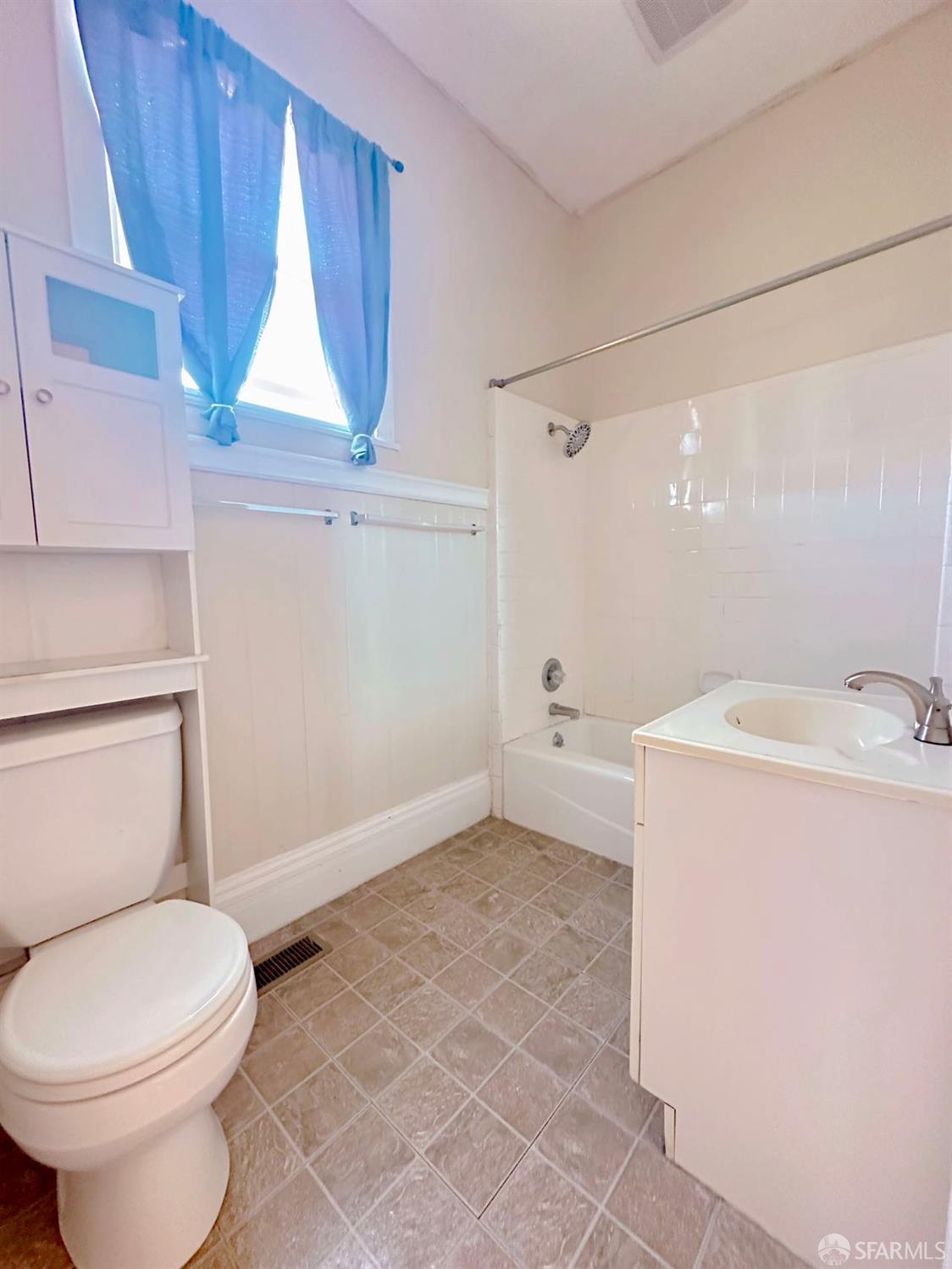 322 Commercial Avenue South San Francisco, CA 94080 - Photo 27 of 32 a bathroom with a sink a toilet and a window