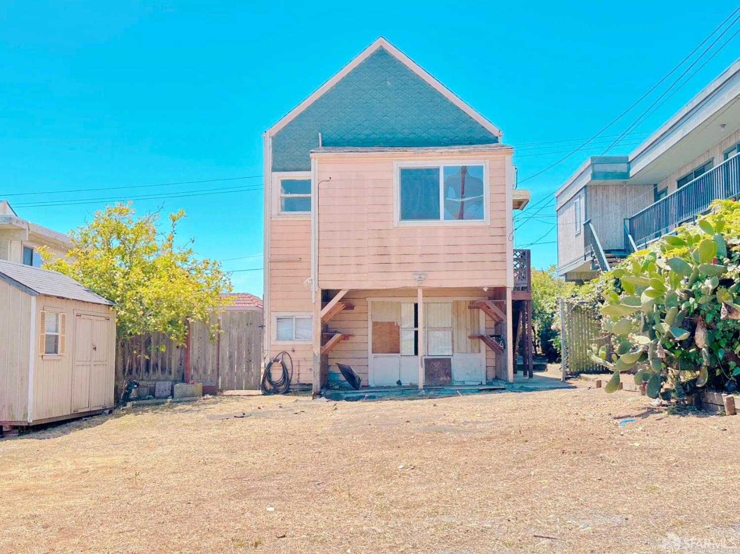322 Commercial Avenue South San Francisco, CA 94080 - Photo 28 of 32 a front view of a house with a yard and garage