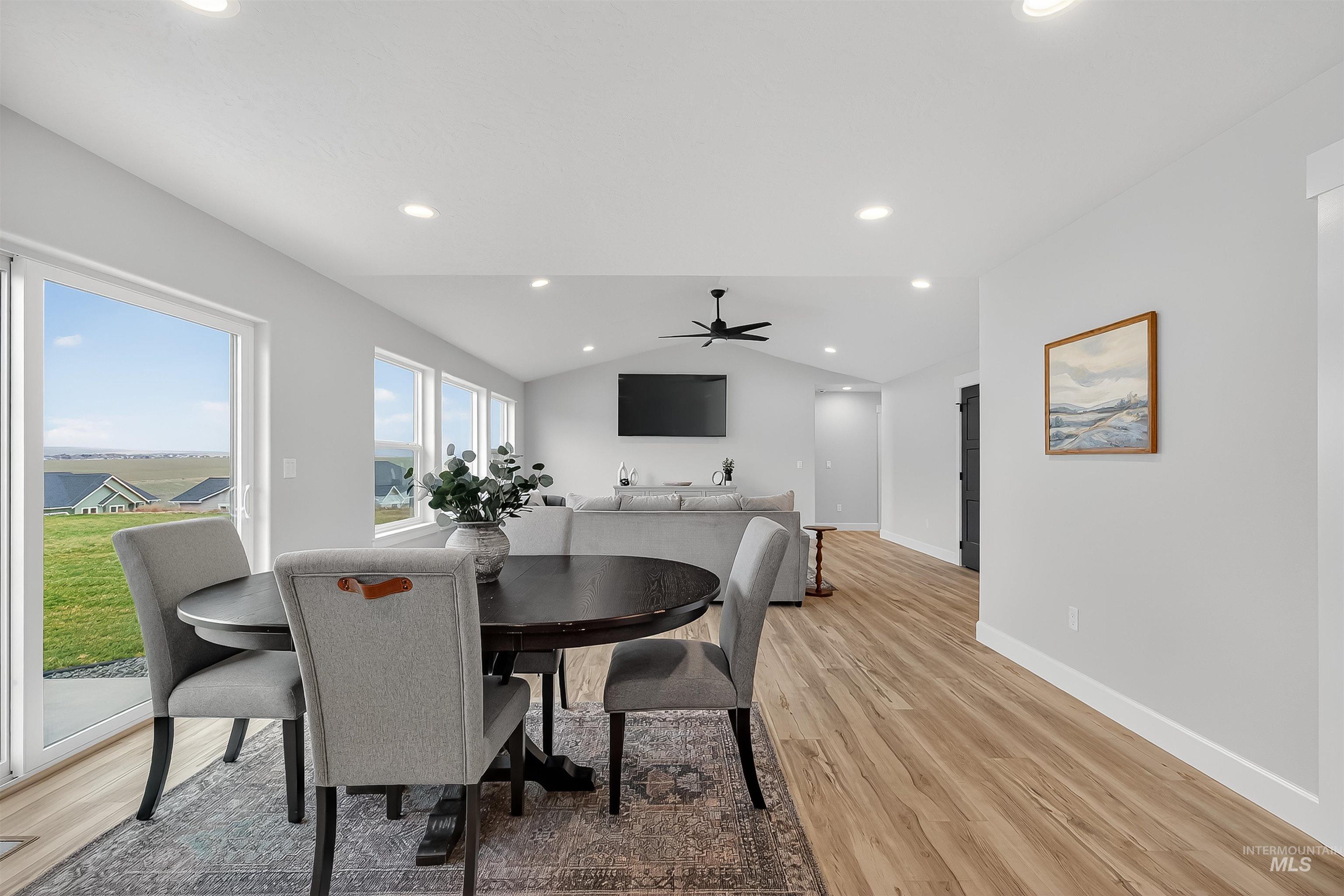 1725 Pathway Court Lewiston, ID 83501 - Photo 12 of 37 Dining area featuring lofted ceiling, light wood-style floors, ceiling fan, and recessed lighting