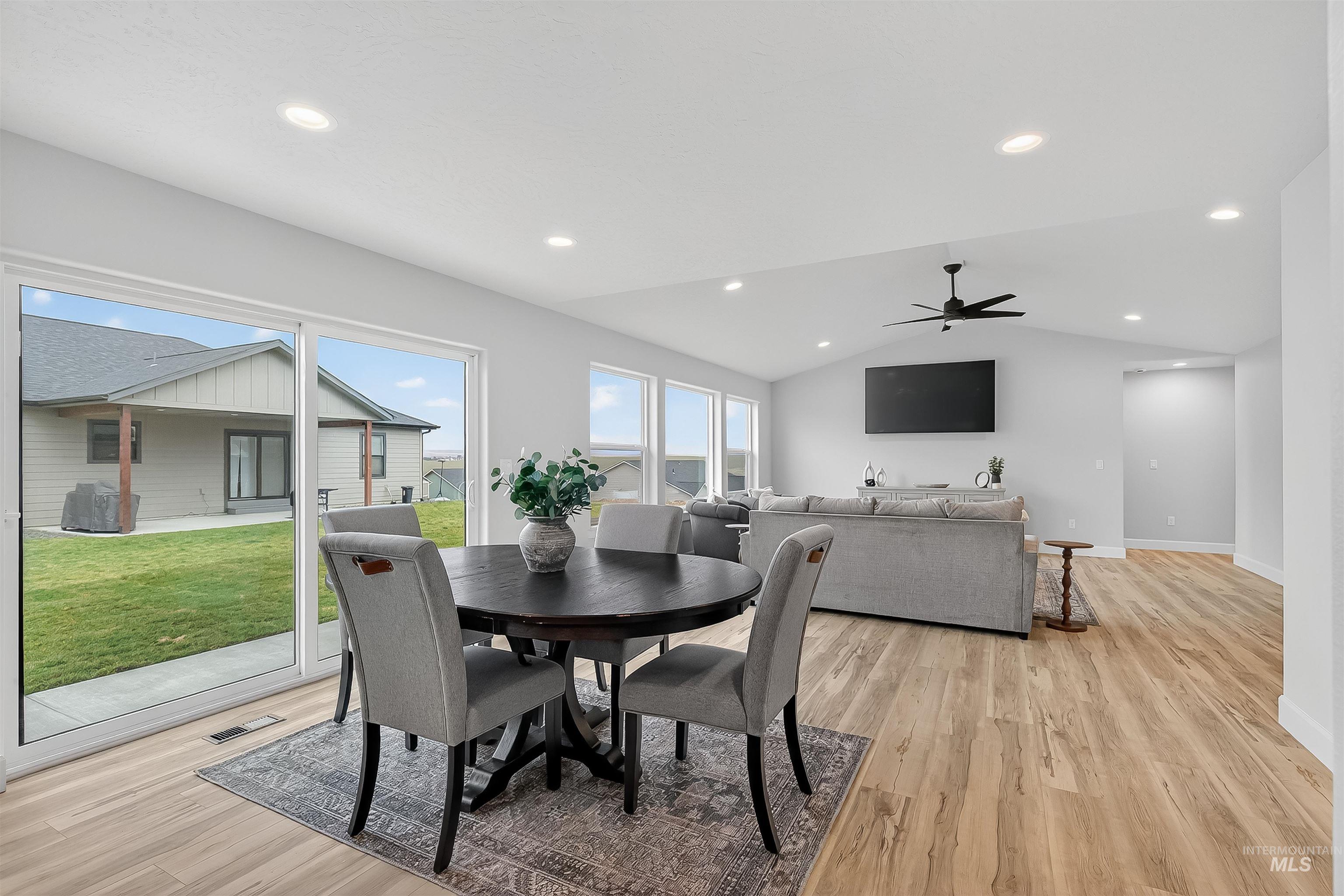 1725 Pathway Court Lewiston, ID 83501 - Photo 13 of 37 Dining area featuring vaulted ceiling, light wood-type flooring, recessed lighting, and ceiling fan