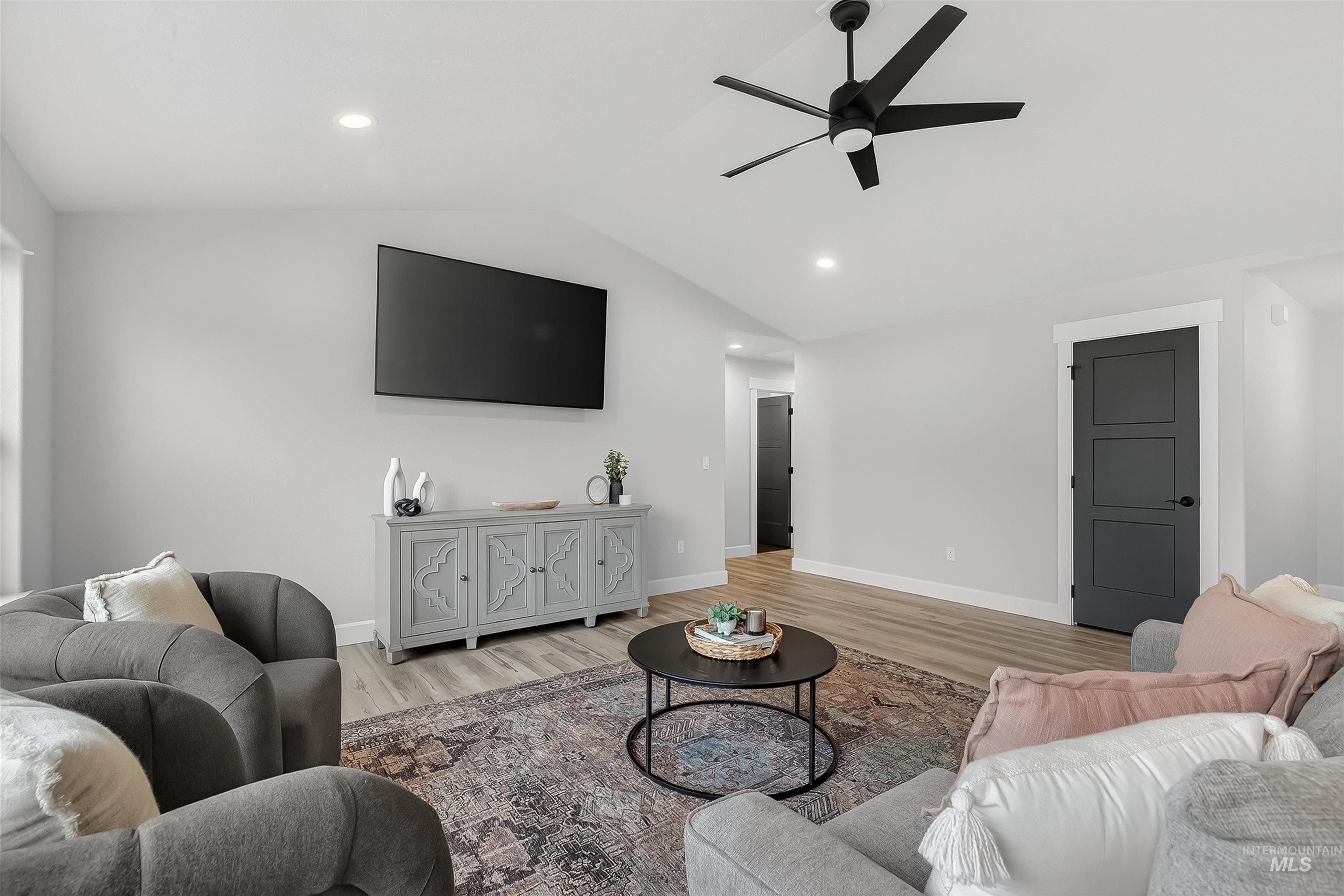 1725 Pathway Court Lewiston, ID 83501 - Photo 14 of 37 Living room with ceiling fan, lofted ceiling, wood finished floors, and recessed lighting