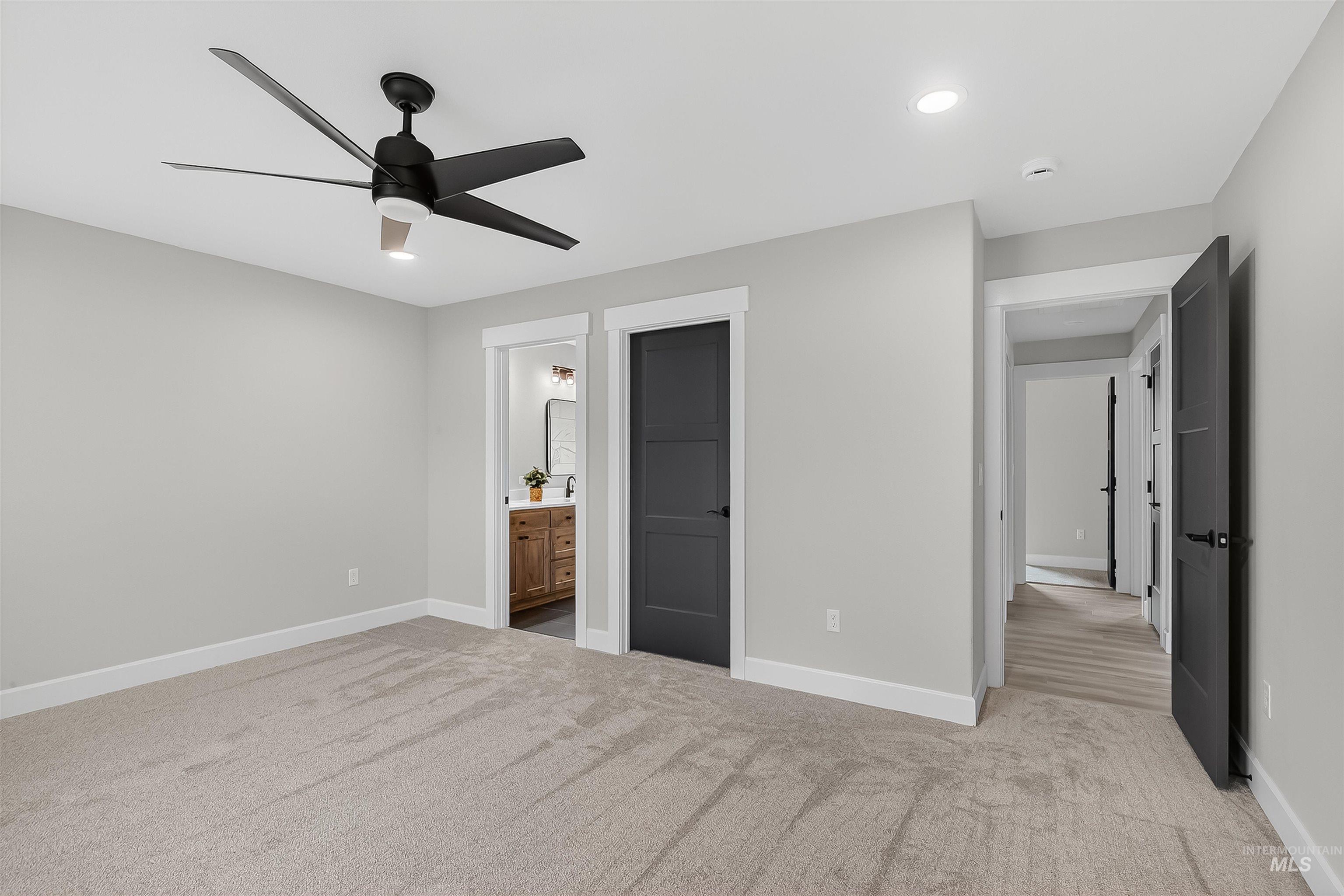 1725 Pathway Court Lewiston, ID 83501 - Photo 20 of 37 Unfurnished bedroom with light carpet, a ceiling fan, recessed lighting, and ensuite bath