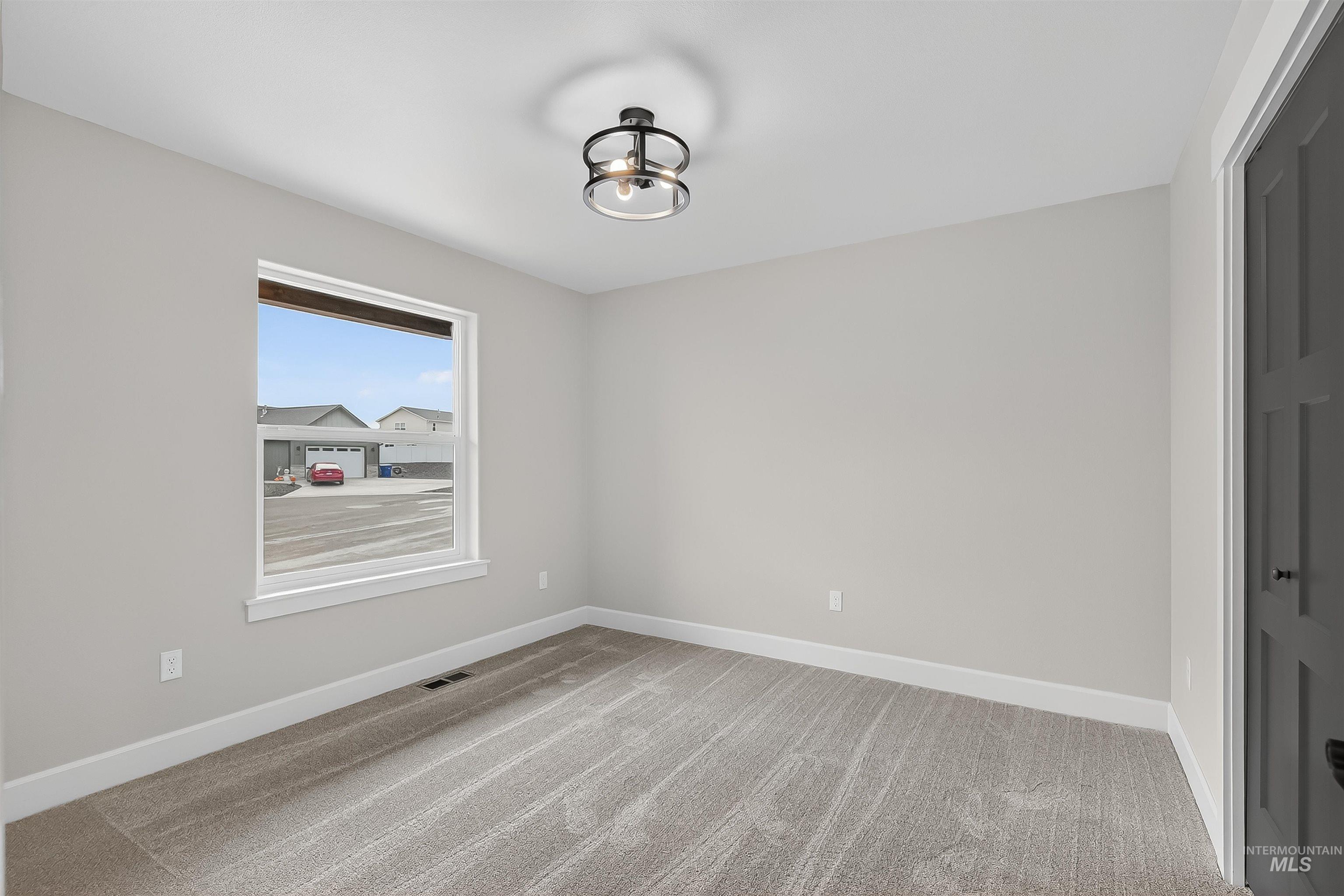1725 Pathway Court Lewiston, ID 83501 - Photo 24 of 37 Unfurnished room featuring light colored carpet and baseboards