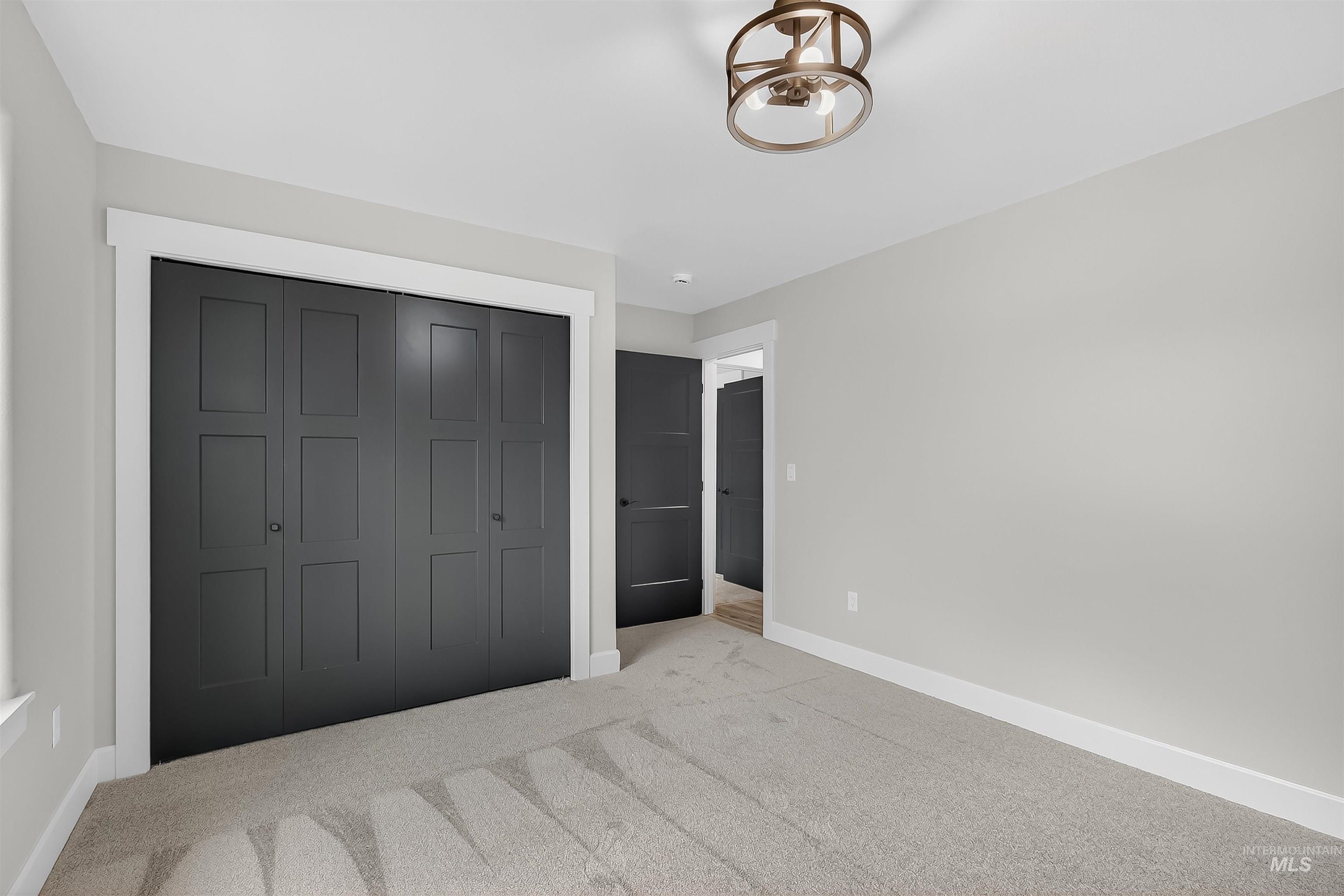 1725 Pathway Court Lewiston, ID 83501 - Photo 29 of 37 Unfurnished bedroom featuring a closet and carpet flooring