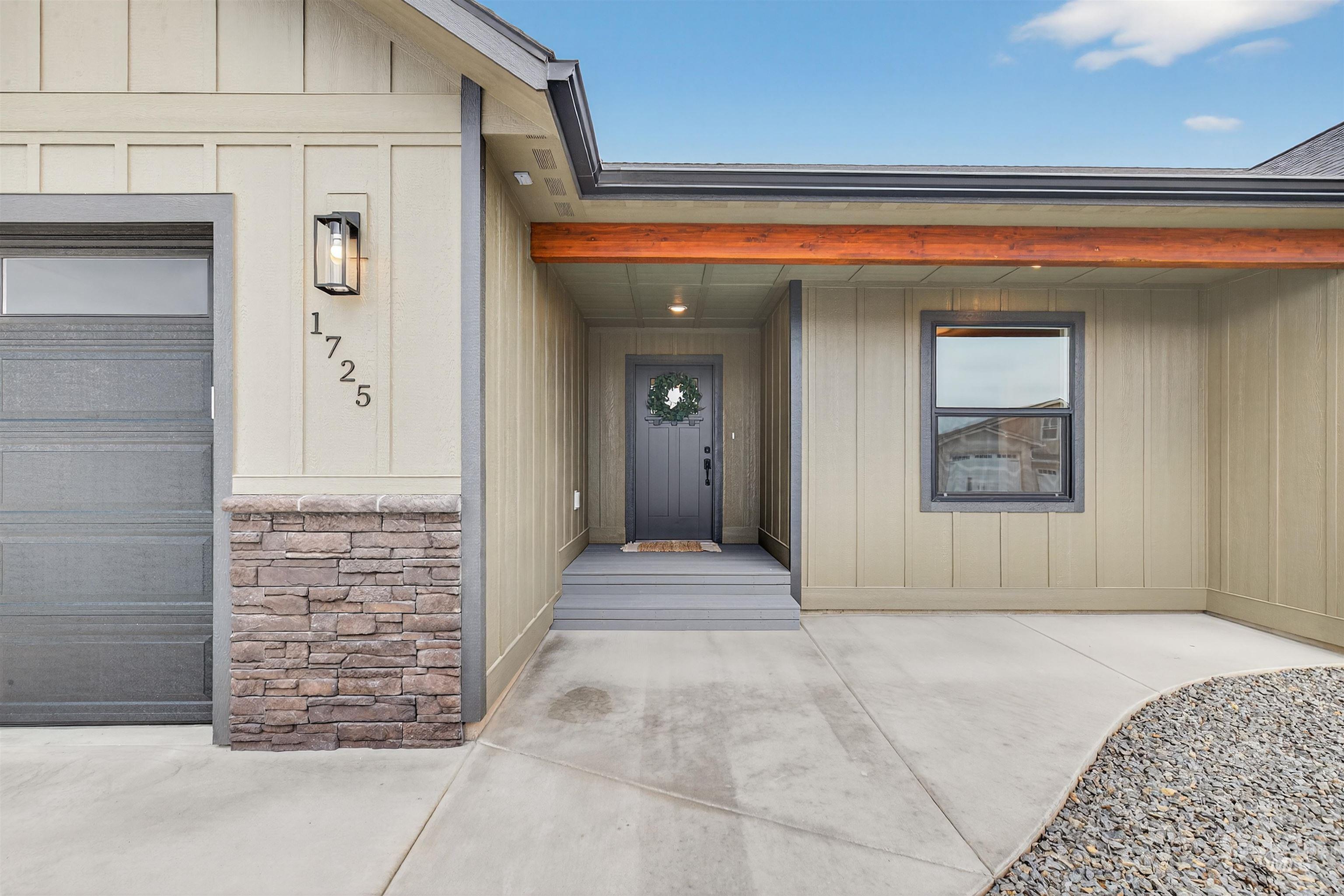 1725 Pathway Court Lewiston, ID 83501 - Photo 3 of 37 View of exterior entry with stone siding and board and batten siding
