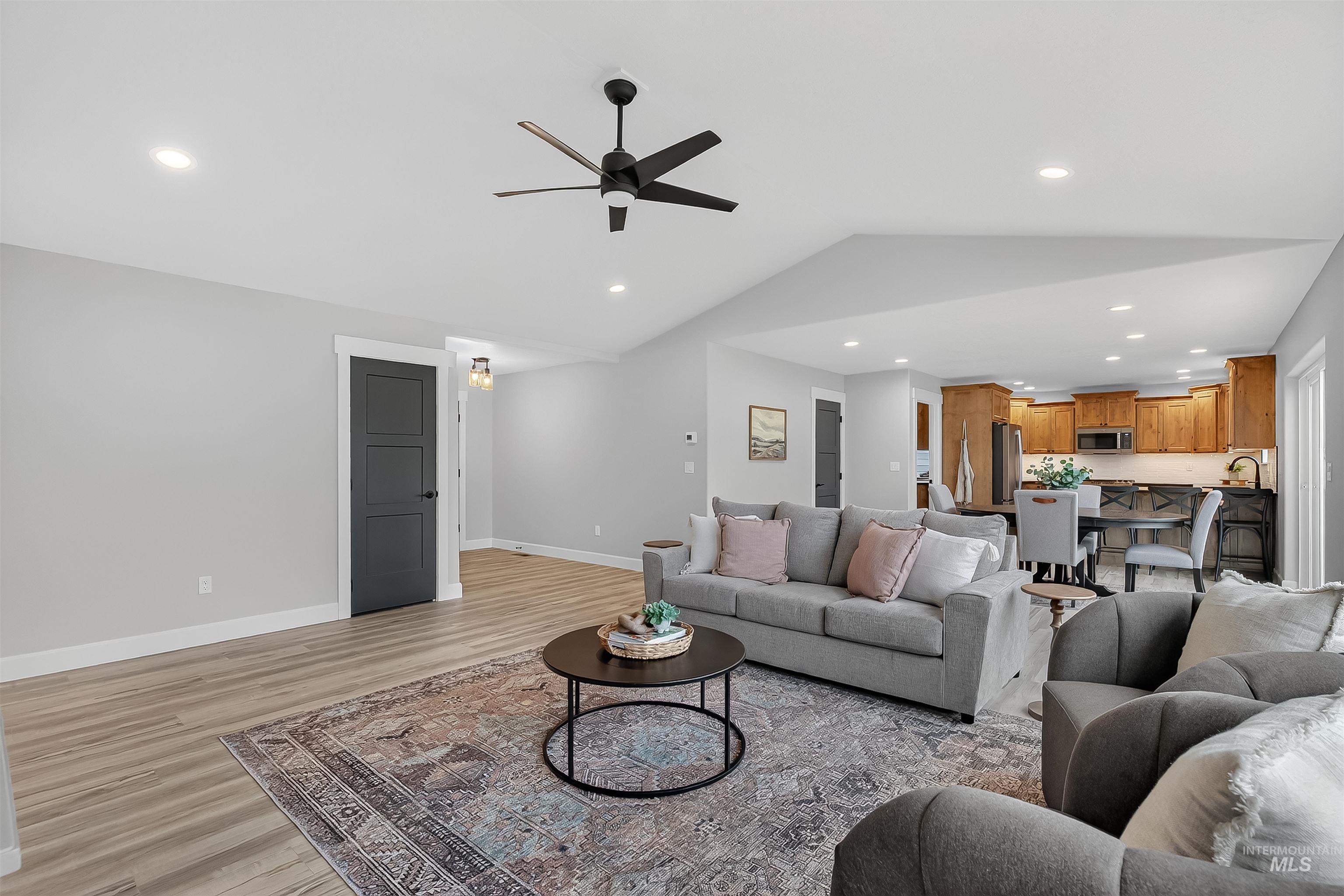 1725 Pathway Court Lewiston, ID 83501 - Photo 5 of 37 Living room featuring recessed lighting, light wood-style flooring, ceiling fan, and lofted ceiling