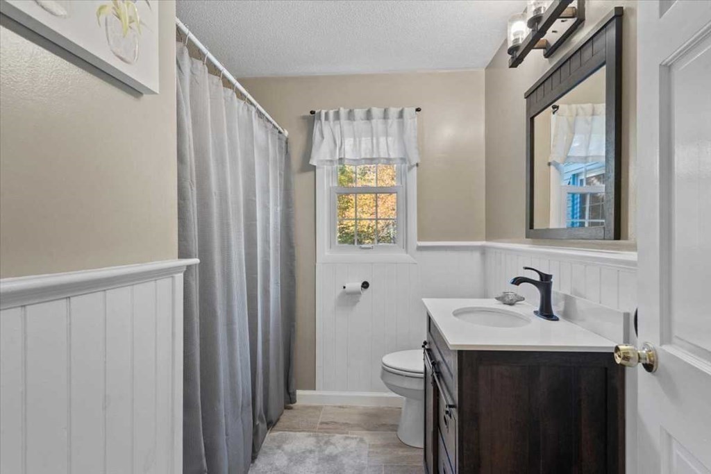 170 Shepard Road Sturbridge, MA 01566 - Photo 11 of 41 a bathroom with a sink a mirror and a window