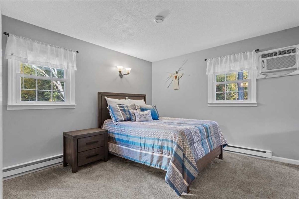 170 Shepard Road Sturbridge, MA 01566 - Photo 17 of 41 a bedroom with a bed and a window