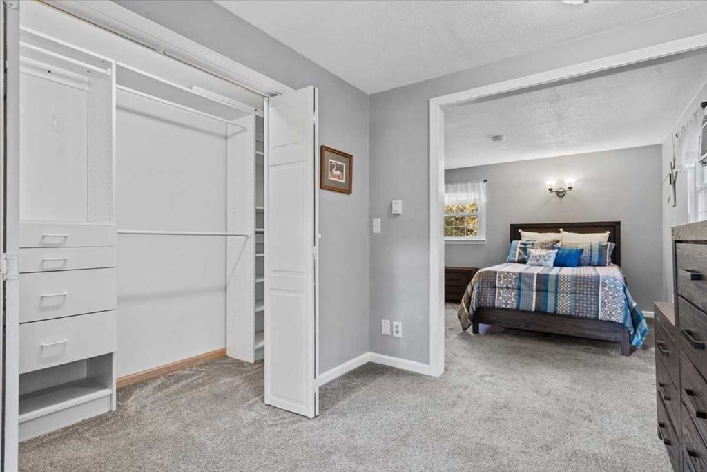 170 Shepard Road Sturbridge, MA 01566 - Photo 21 of 41 a bedroom with a bed and cabinet