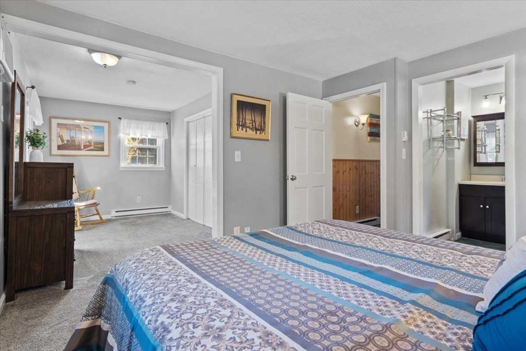 170 Shepard Road Sturbridge, MA 01566 - Photo 22 of 41 a bedroom with a bed and a dresser