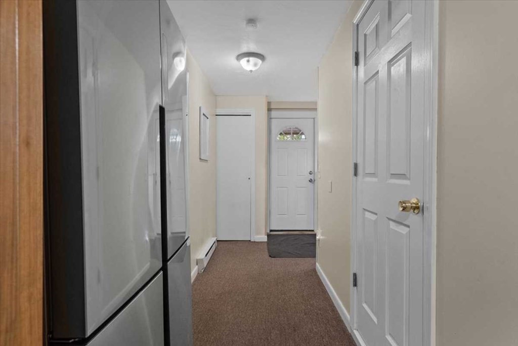 170 Shepard Road Sturbridge, MA 01566 - Photo 31 of 41 a view of a hallway with closet and wooden floor