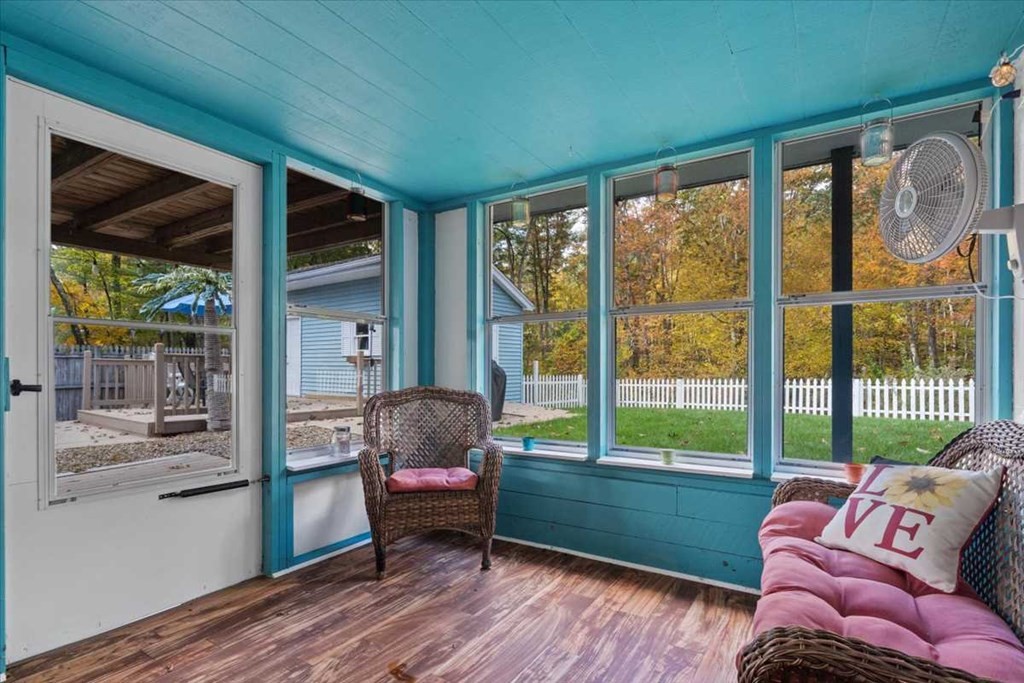 170 Shepard Road Sturbridge, MA 01566 - Photo 35 of 41 a living room filled with furniture and a floor to ceiling window