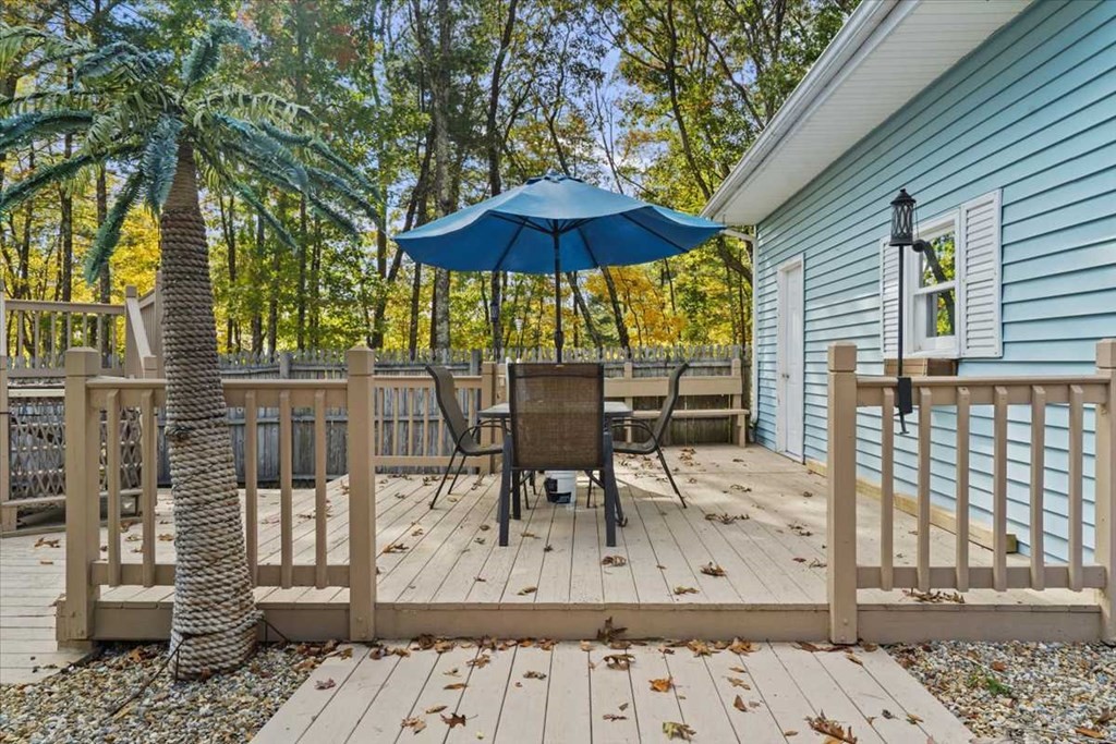 170 Shepard Road Sturbridge, MA 01566 - Photo 37 of 41 a view of a patio with table and chairs under an umbrella