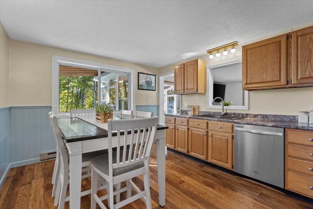 170 Shepard Road Sturbridge, MA 01566 - Photo 7 of 41 a open kitchen with granite countertop a sink table and chairs