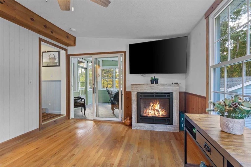 170 Shepard Road Sturbridge, MA 01566 - Photo 9 of 41 a living room with furniture a fireplace and a flat screen tv