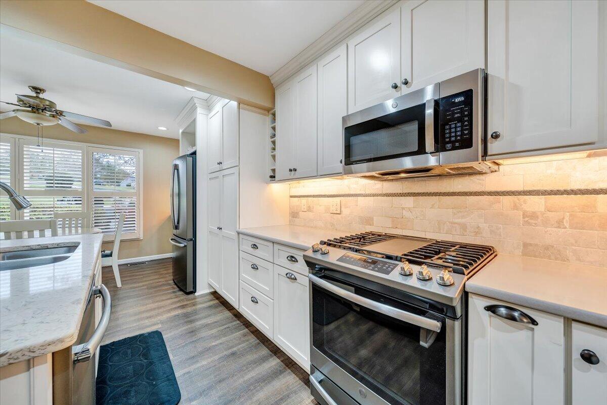 66 Scarlet Street Hardy, VA 24101 - Photo 13 of 72 a kitchen with stainless steel appliances a stove microwave and sink