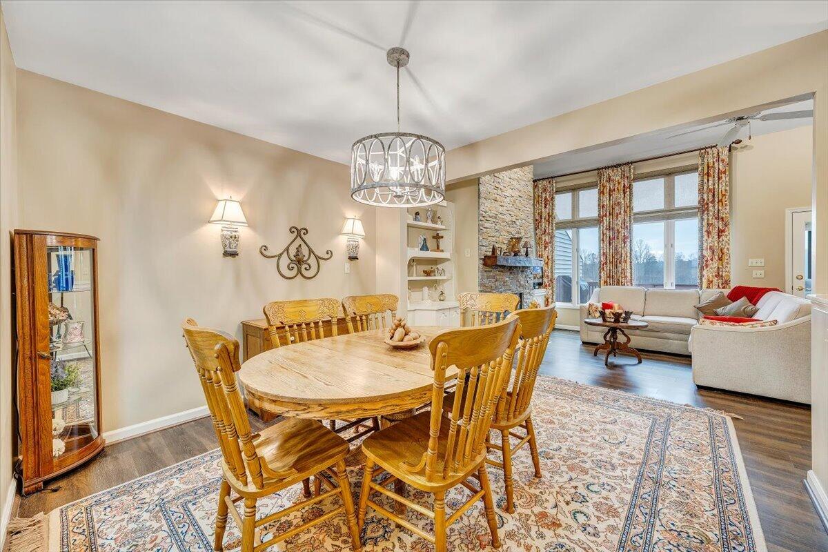 66 Scarlet Street Hardy, VA 24101 - Photo 25 of 72 a dining room with furniture a chandelier and wooden floor