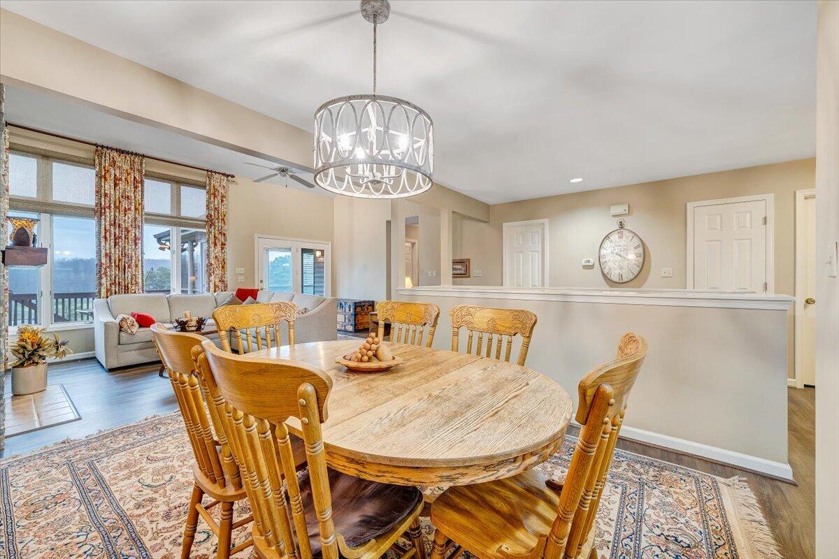 66 Scarlet Street Hardy, VA 24101 - Photo 26 of 72 a view of a dining room with furniture a chandelier and wooden floor
