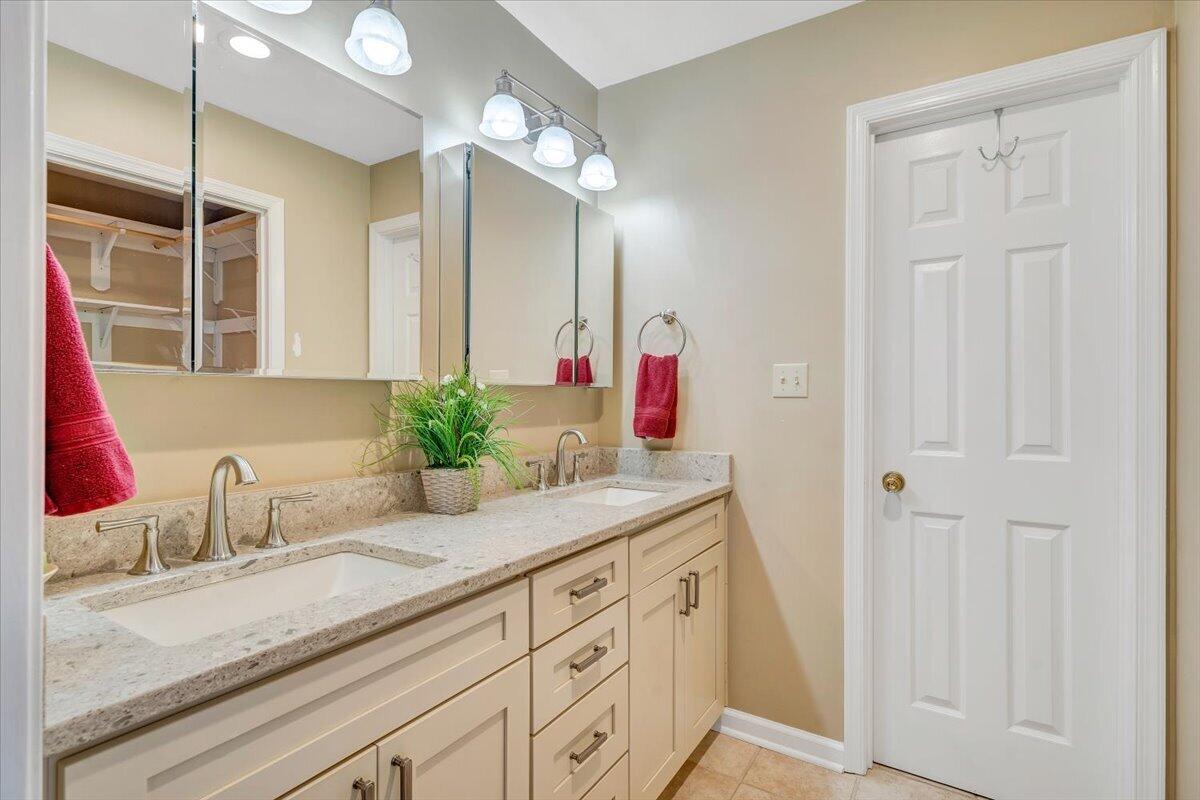 66 Scarlet Street Hardy, VA 24101 - Photo 30 of 72 a bathroom with a granite countertop sink and a mirror