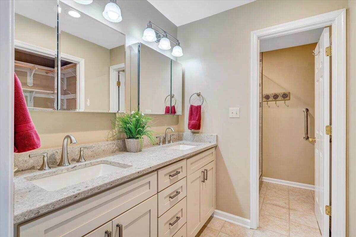 66 Scarlet Street Hardy, VA 24101 - Photo 31 of 72 a bathroom with a granite countertop sink and a mirror