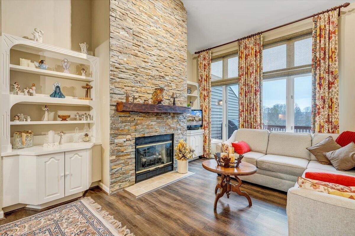 66 Scarlet Street Hardy, VA 24101 - Photo 6 of 72 a living room with furniture a fireplace and a floor to ceiling window