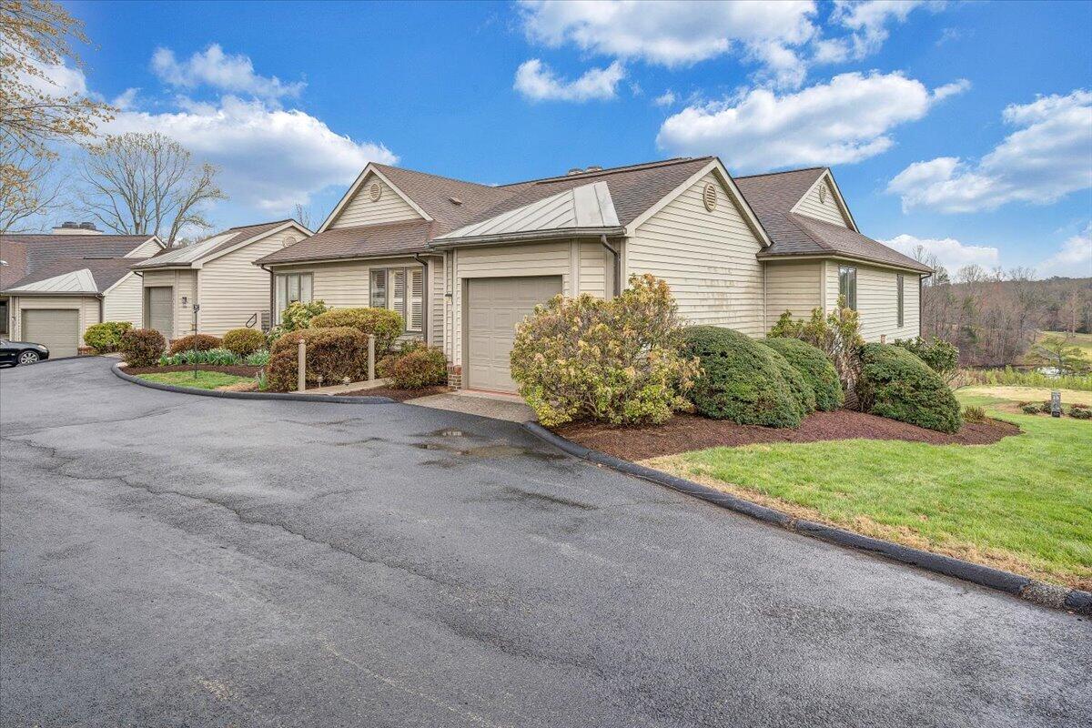 66 Scarlet Street Hardy, VA 24101 - Photo 68 of 72 a view of a white house with a yard and plants