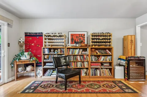 a dining room with furniture and wooden floor