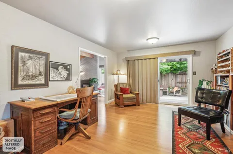 a kitchen with granite countertop stainless steel appliances a refrigerator a stove a sink and wooden cabinets