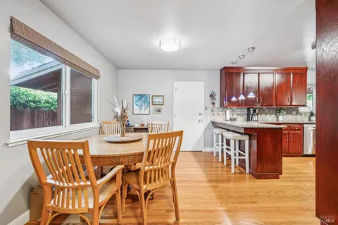 a kitchen with stainless steel appliances granite countertop wooden cabinets a sink and dishwasher