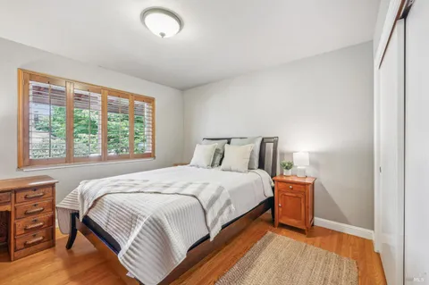 a view of a workspace with furniture and a bedroom