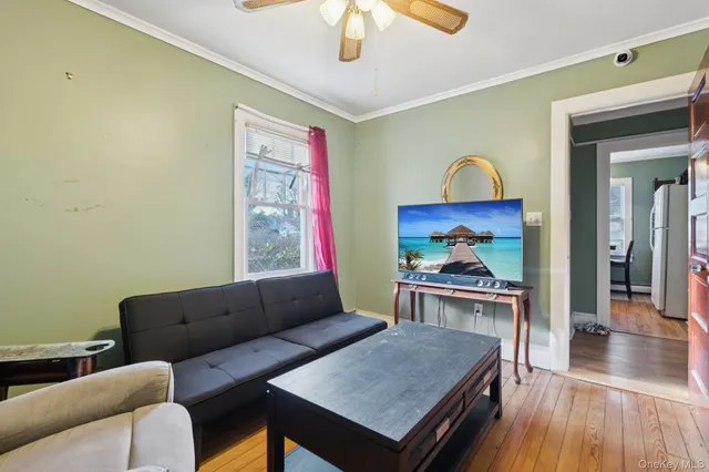 a dining room with furniture a rug and wooden floor