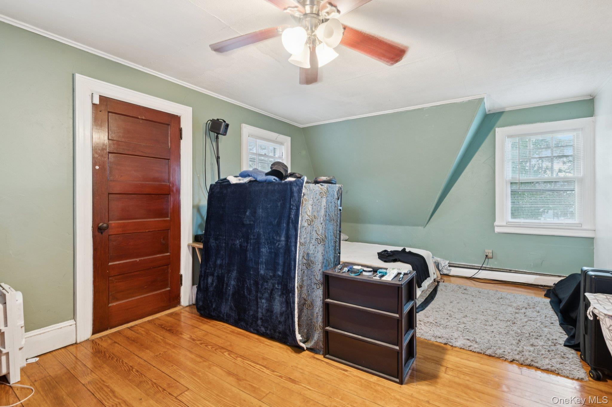 83 Elm Road East Mastic Beach, NY 11951 - Photo 9 of 34 a bedroom with a bed and a window