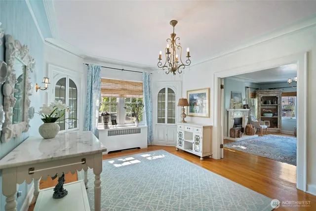 a view of a livingroom with furniture window and wooden floor