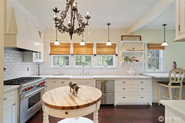 a kitchen with a sink stove and window