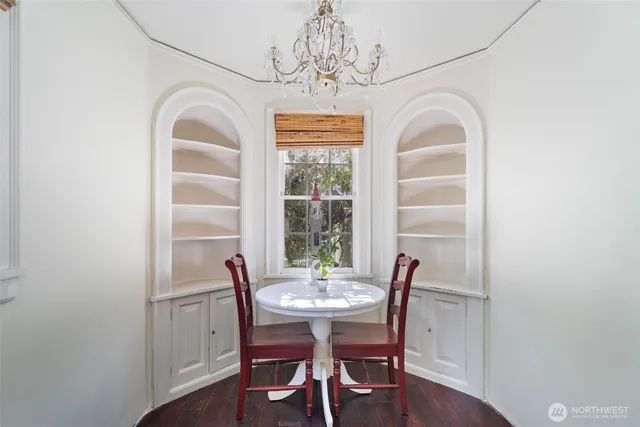 a view of a dining room with furniture window and wooden floor