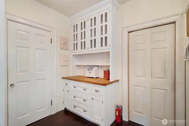 a room with cabinets and wooden floor
