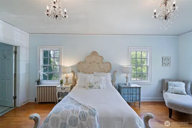a bedroom with a large bed and a window