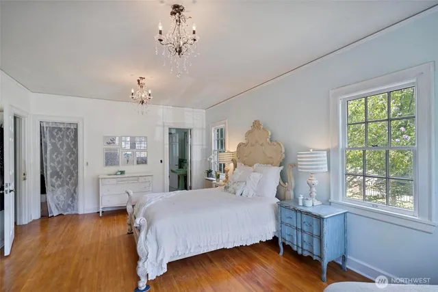 a bed room with a bed and a window