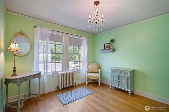 a view of a livingroom with furniture and a window