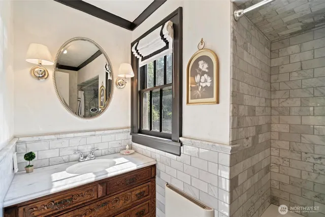 a bathroom with a sink and a mirror