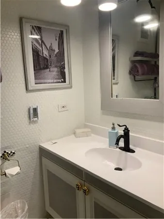 a bathroom with a sink and a mirror