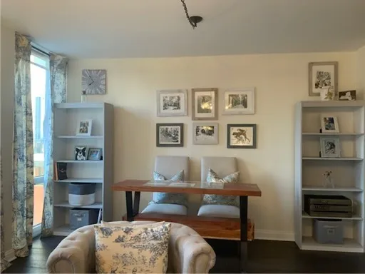 a living room with furniture and a lamp