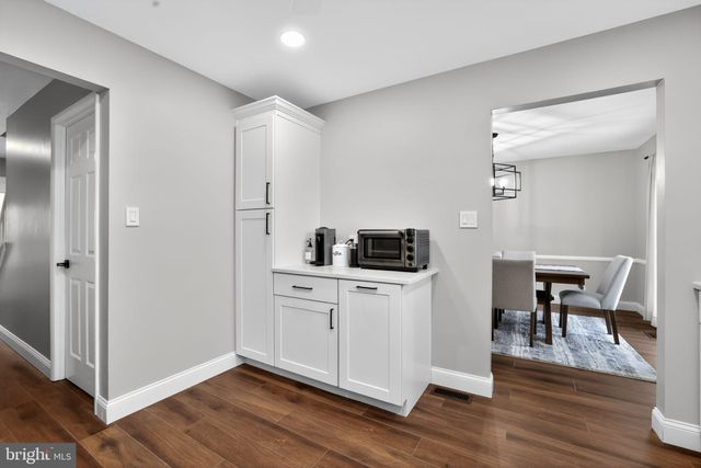a kitchen with a sink stainless steel appliances and counter space