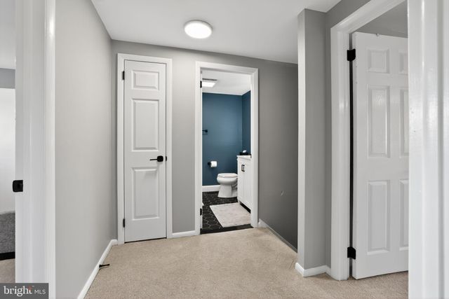 a bathroom with a sink toilet and vanity