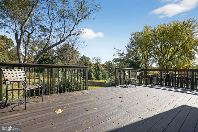 a workspace with wooden floor and furniture