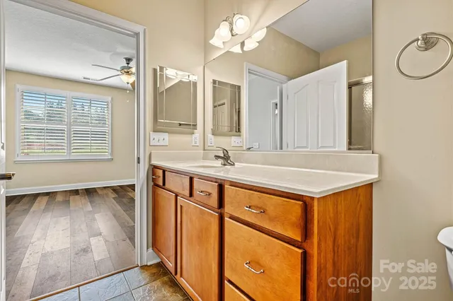 a bathroom with a sink double vanity and a mirror